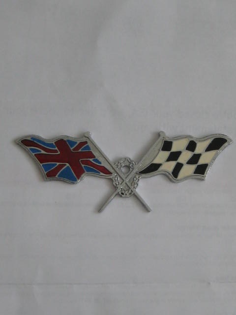 Click the image for more info 1960's LES LESTON CROSSED FLAGS CAR BADGE 1960's